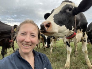 Kate-Steensma-and-a-member-of-the-Steensma-milking-herd-photo-courtesy-of-Kate-Steensma