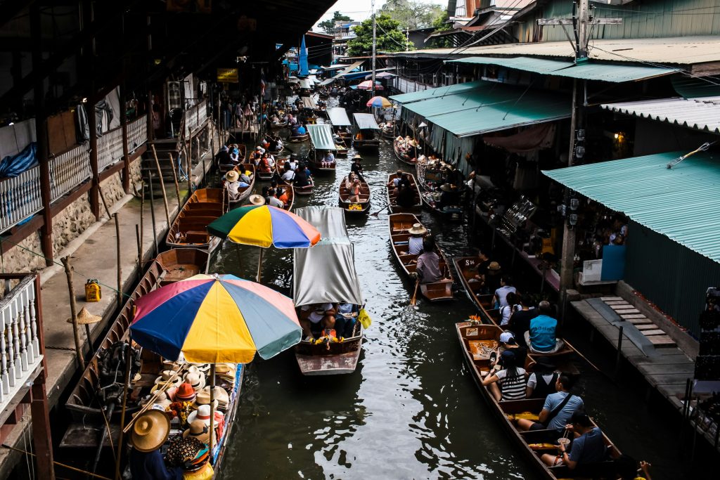 shopping at the floating market is one of the best things to do in thailand for adults